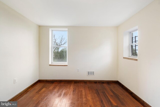 2400 Druid Hill Ave, Baltimore, MD 21217 - empty room featuring healthy amount of natural light and dark wood-style floors
