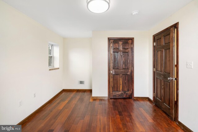 2400 Druid Hill Ave, Baltimore, MD 21217 - unfurnished room featuring wood-type flooring and baseboards