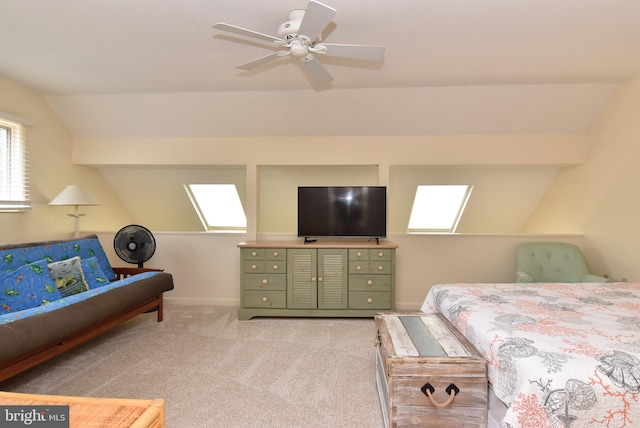 20802 Spring Lake Dr Unit 427, Rehoboth Beach, DE 19971 - bedroom with lofted ceiling, light carpet, a skylight, ceiling fan, and baseboards
