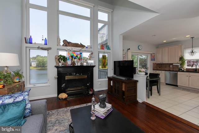 1504 Champlain Dr, Voorhees, NJ 08043 - living area featuring a fireplace with flush hearth, baseboards, light wood finished floors, and recessed lighting
