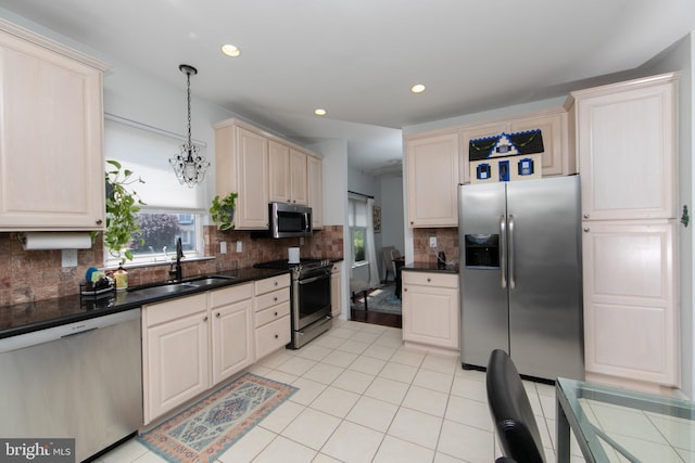 1504 Champlain Dr, Voorhees, NJ 08043 - kitchen with appliances with stainless steel finishes, healthy amount of natural light, dark countertops, a sink, and recessed lighting