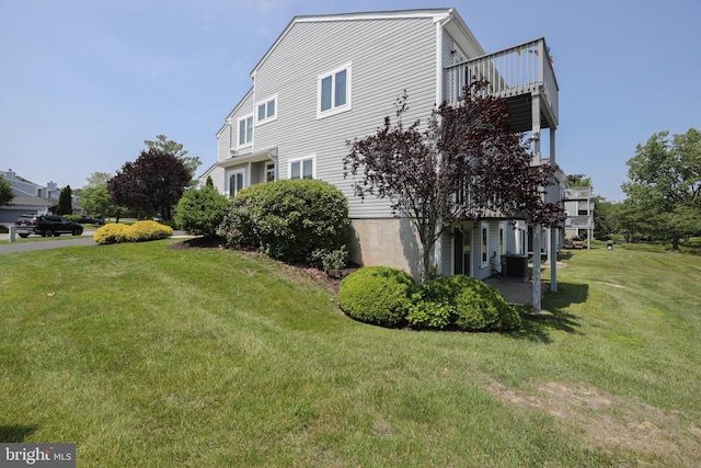 1504 Champlain Dr, Voorhees, NJ 08043 - view of home's exterior featuring a lawn, central AC, and a balcony