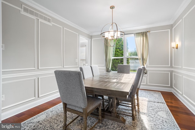 11 Bancroft Ln, Hainesport, NJ 08036 - dining space with a decorative wall, a chandelier, crown molding, and dark wood finished floors