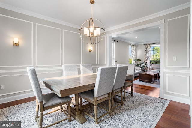 11 Bancroft Ln, Hainesport, NJ 08036 - dining space with a decorative wall, a chandelier, crown molding, and wood finished floors