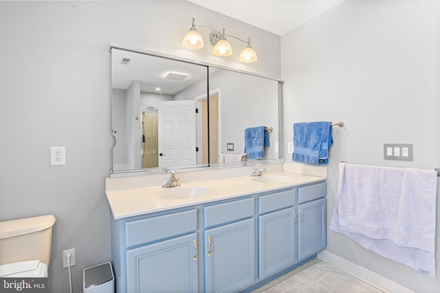 11 Bancroft Ln, Hainesport, NJ 08036 - full bath with double vanity, toilet, a shower with door, and baseboards