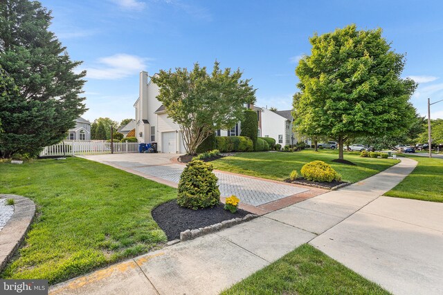 11 Bancroft Ln, Hainesport, NJ 08036 - view of property hidden behind natural elements featuring driveway, a residential view, and a garage