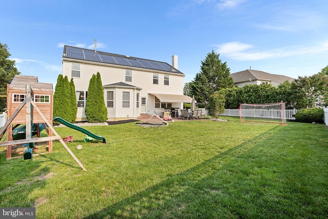 11 Bancroft Ln, Hainesport, NJ 08036 - rear view of property with a patio, a playground, and a chimney