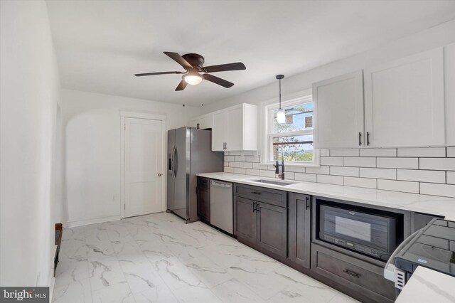 3330 E Prospect Rd, York, PA 17402 - kitchen with a sink, stainless steel appliances, decorative backsplash, ceiling fan, and light marble finish floors