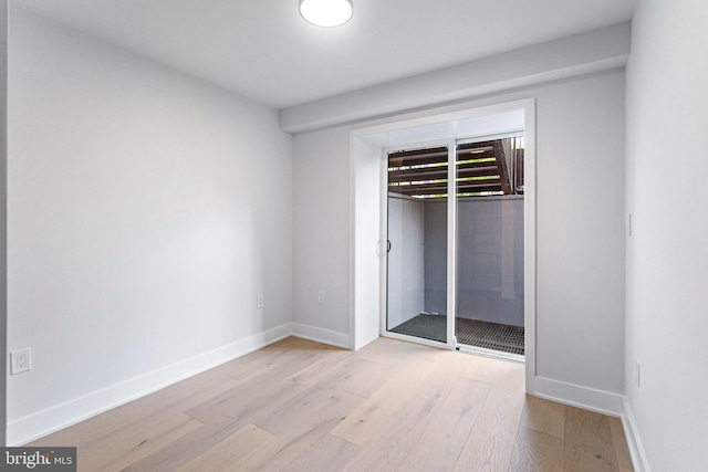 845 19th St NE Unit 4, Washington, DC 20002 - unfurnished bedroom with wood finished floors, a closet, and baseboards