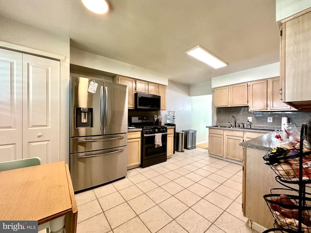 211 Franklin Ave, Berlin, NJ 08009 - kitchen with stainless steel appliances, light tile patterned floors, decorative backsplash, light brown cabinetry, and dark countertops