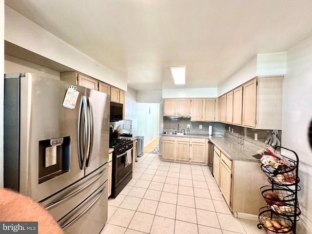 211 Franklin Ave, Berlin, NJ 08009 - kitchen featuring black appliances, light tile patterned floors, decorative backsplash, light brown cabinetry, and light countertops