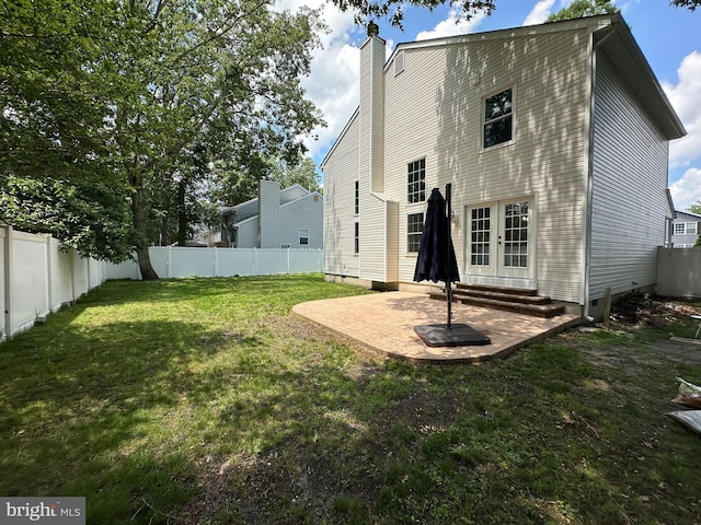 211 Franklin Ave, Berlin, NJ 08009 - rear view of property with a patio, a fenced backyard, french doors, and a chimney
