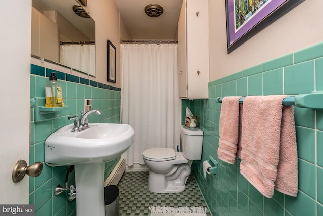 1034-1040 Twin County Rd, Honey Brook, PA 19344 - bathroom with tile walls, toilet, tile patterned floors, a wainscoted wall, and a baseboard heating unit