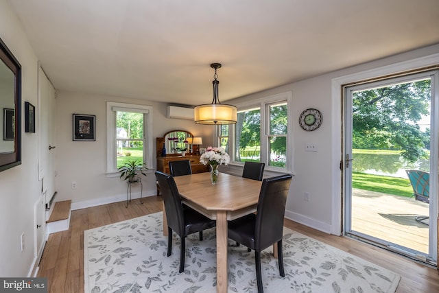 1034-1040 Twin County Rd, Honey Brook, PA 19344 - dining room with an AC wall unit, healthy amount of natural light, light wood-style floors, and baseboards