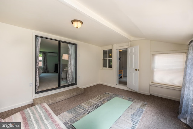 1034-1040 Twin County Rd, Honey Brook, PA 19344 - unfurnished bedroom with vaulted ceiling, carpet floors, a wall unit AC, and baseboards