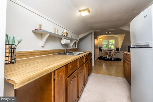 1034-1040 Twin County Rd, Honey Brook, PA 19344 - kitchen with freestanding refrigerator, a sink, open shelves, light countertops, and vaulted ceiling