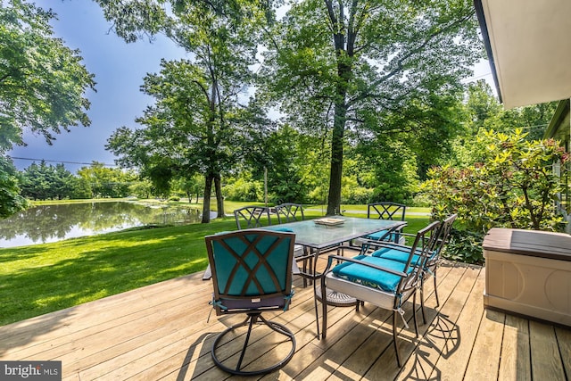 1034-1040 Twin County Rd, Honey Brook, PA 19344 - wooden deck featuring outdoor dining area, a water view, a yard, and view of wooded area