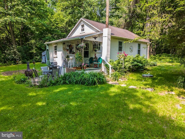 1034-1040 Twin County Rd, Honey Brook, PA 19344 - view of front of property with a front yard, a porch, and stucco siding