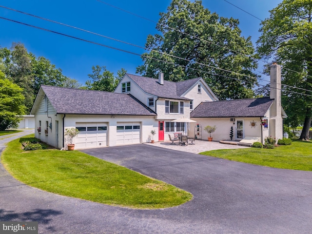 1034-1040 Twin County Rd, Honey Brook, PA 19344 - traditional-style house featuring a chimney, an attached garage, driveway, and stucco siding