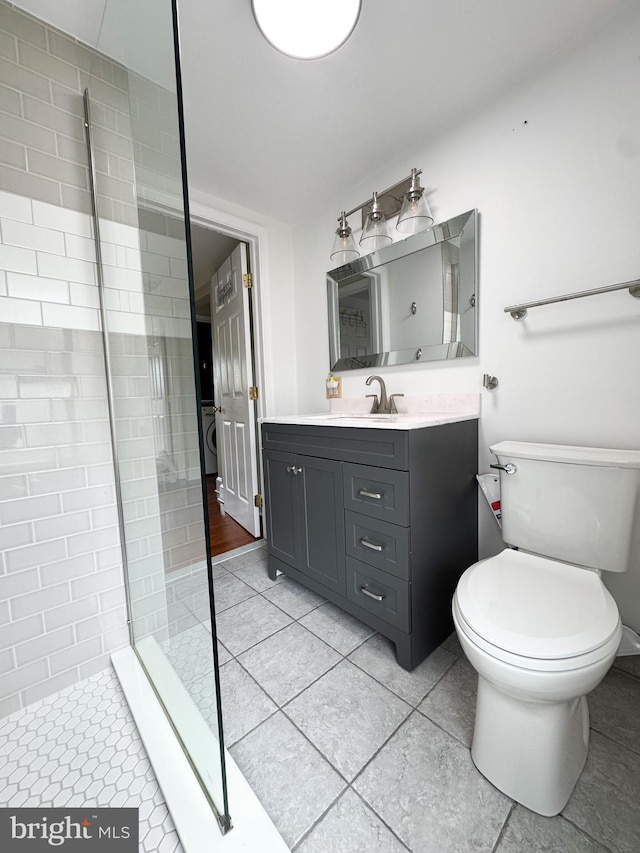 117 E Montgomery Ave, Hatboro, PA 19040 - full bath featuring vanity, a tile shower, tile patterned flooring, toilet, and washer / dryer