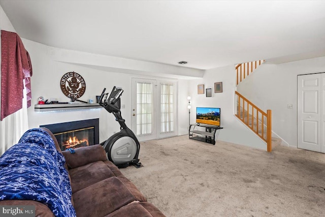1417 Cambridge Ct, Palmyra, PA 17078 - carpeted living room featuring stairs and a glass covered fireplace