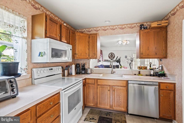 1417 Cambridge Ct, Palmyra, PA 17078 - kitchen with white appliances, a sink, light countertops, and brown cabinets