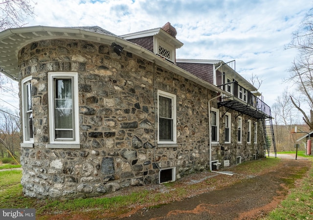 00 Devereux Rd, Glenmoore, PA 19343 - view of home's exterior featuring stone siding and a balcony