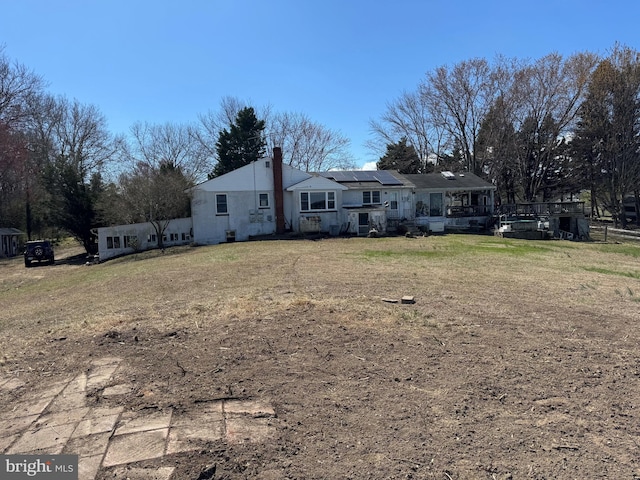 41130 Cryer Ct, Leonardtown, MD 20650 - rear view of property featuring solar panels and a chimney