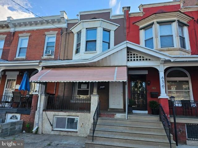 634 N 56th St, Philadelphia, PA 19131 - townhome / multi-family property with a porch