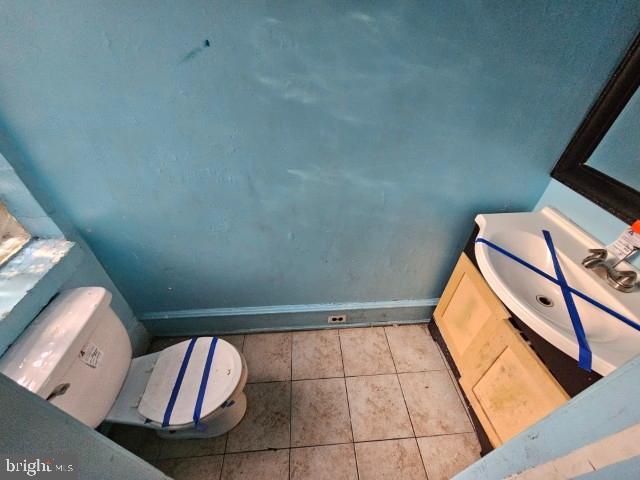 634 N 56th St, Philadelphia, PA 19131 - bathroom with toilet, tile patterned flooring, baseboards, and vanity