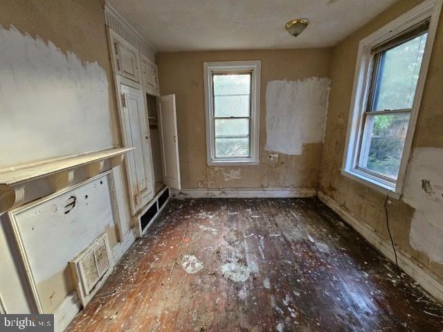634 N 56th St, Philadelphia, PA 19131 - empty room featuring hardwood / wood-style floors, healthy amount of natural light, and baseboards