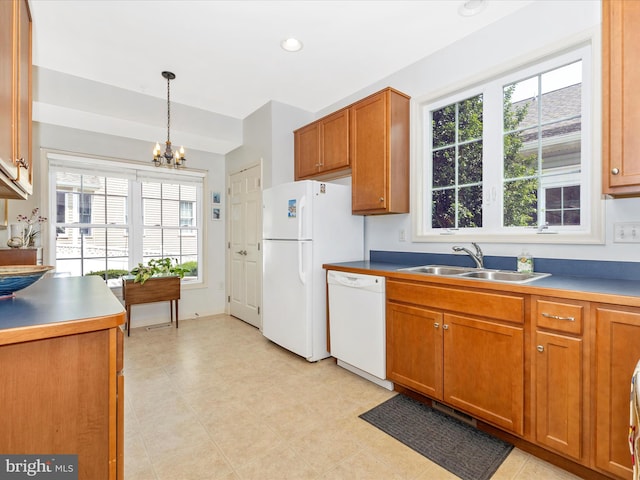 6 Stine Ct, Middletown, MD 21769 - kitchen with white appliances, a chandelier, plenty of natural light, and brown cabinets