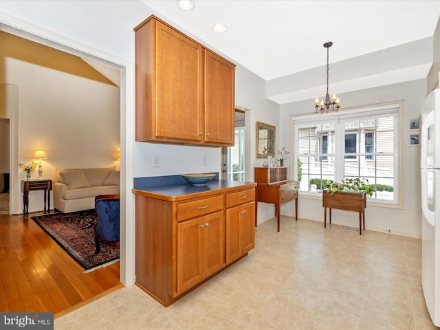 6 Stine Ct, Middletown, MD 21769 - kitchen featuring a chandelier, brown cabinets, decorative light fixtures, recessed lighting, and freestanding refrigerator