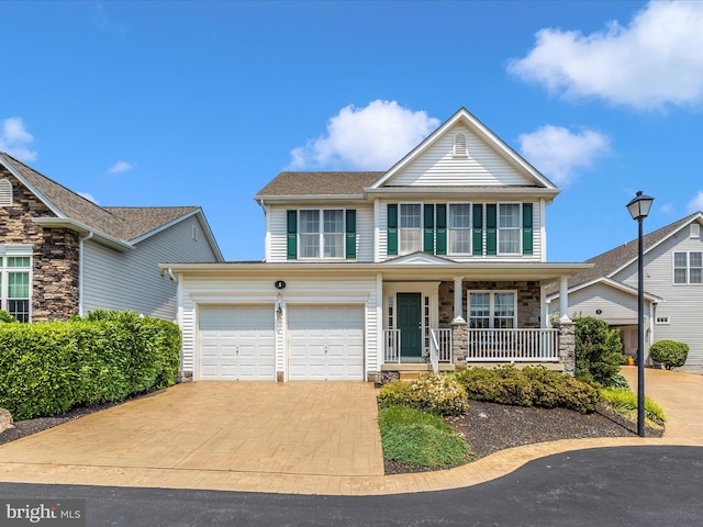 6 Stine Ct, Middletown, MD 21769 - view of front of property featuring a porch, stone siding, and driveway