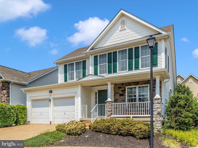 6 Stine Ct, Middletown, MD 21769 - view of front of property with a porch, stone siding, concrete driveway, and an attached garage