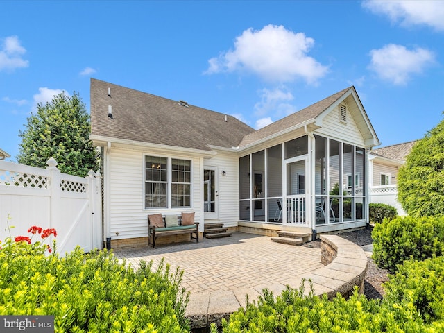 6 Stine Ct, Middletown, MD 21769 - rear view of property featuring a sunroom, a patio area, a shingled roof, entry steps, and a gate
