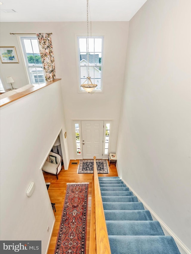 6 Stine Ct, Middletown, MD 21769 - entryway with light wood-style flooring, stairs, and a chandelier