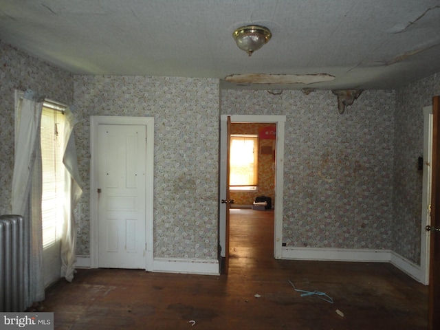 11 W Glendale Ave, Pleasantville, NJ 08232 - empty room with hardwood / wood-style floors, radiator, baseboards, and wallpapered walls