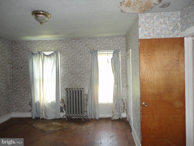 11 W Glendale Ave, Pleasantville, NJ 08232 - spare room with radiator, hardwood / wood-style floors, and wallpapered walls