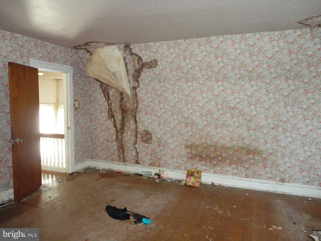 11 W Glendale Ave, Pleasantville, NJ 08232 - unfurnished room with wallpapered walls, wood-type flooring, and baseboards