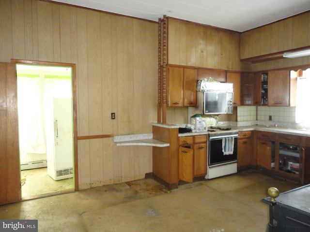 11 W Glendale Ave, Pleasantville, NJ 08232 - kitchen featuring white range oven, brown cabinetry, light countertops, wood walls, and decorative backsplash