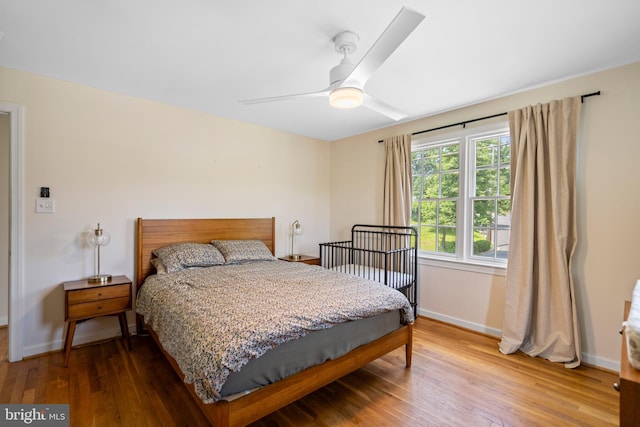 5600 11th St N, Arlington, VA 22205 - bedroom featuring hardwood / wood-style floors, baseboards, and a ceiling fan