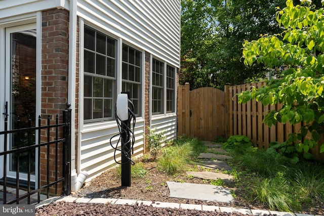 5600 11th St N, Arlington, VA 22205 - property entrance with brick siding and a gate