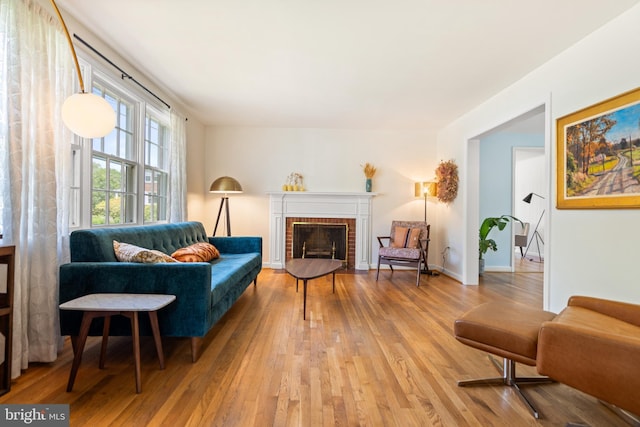 5600 11th St N, Arlington, VA 22205 - living area featuring wood-type flooring and a brick fireplace