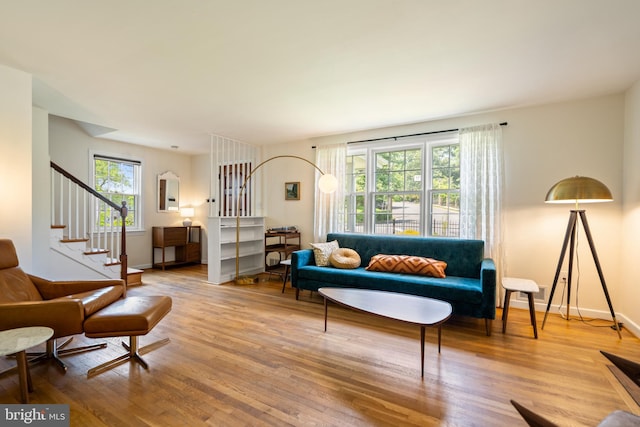 5600 11th St N, Arlington, VA 22205 - living area featuring plenty of natural light, wood finished floors, stairway, and baseboards
