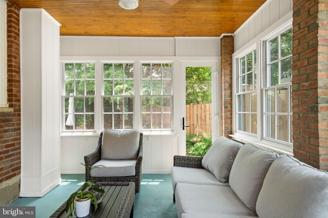 5600 11th St N, Arlington, VA 22205 - sunroom / solarium featuring wood ceiling, brick wall, and carpet floors