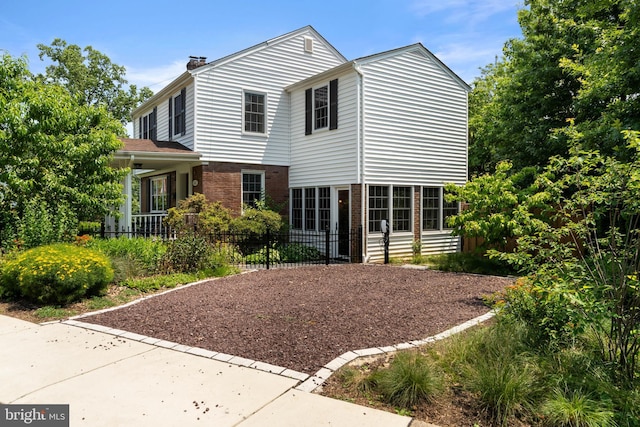 5600 11th St N, Arlington, VA 22205 - traditional home featuring brick siding and a chimney
