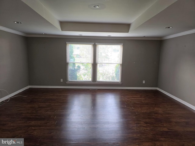 8343 Scotts Level Rd, Pikesville, MD 21208 - spare room featuring a tray ceiling, dark wood-style flooring, baseboards, and ornamental molding