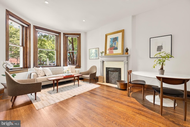 1800 Lamont St NW, Washington, DC 20010 - living room featuring wood finished floors, a fireplace with flush hearth, and recessed lighting