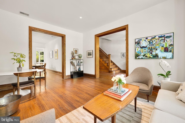 1800 Lamont St NW, Washington, DC 20010 - living area with stairway, light wood-type flooring, baseboards, and recessed lighting